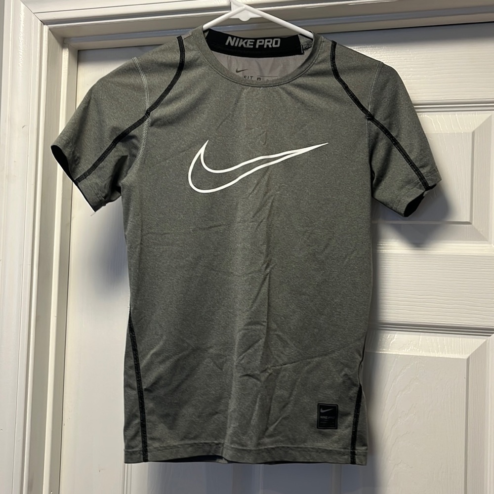 Medium, Nike shirt.